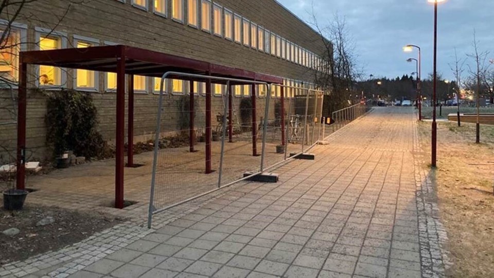Bike parking with covered protection outside the Umeå University Library.